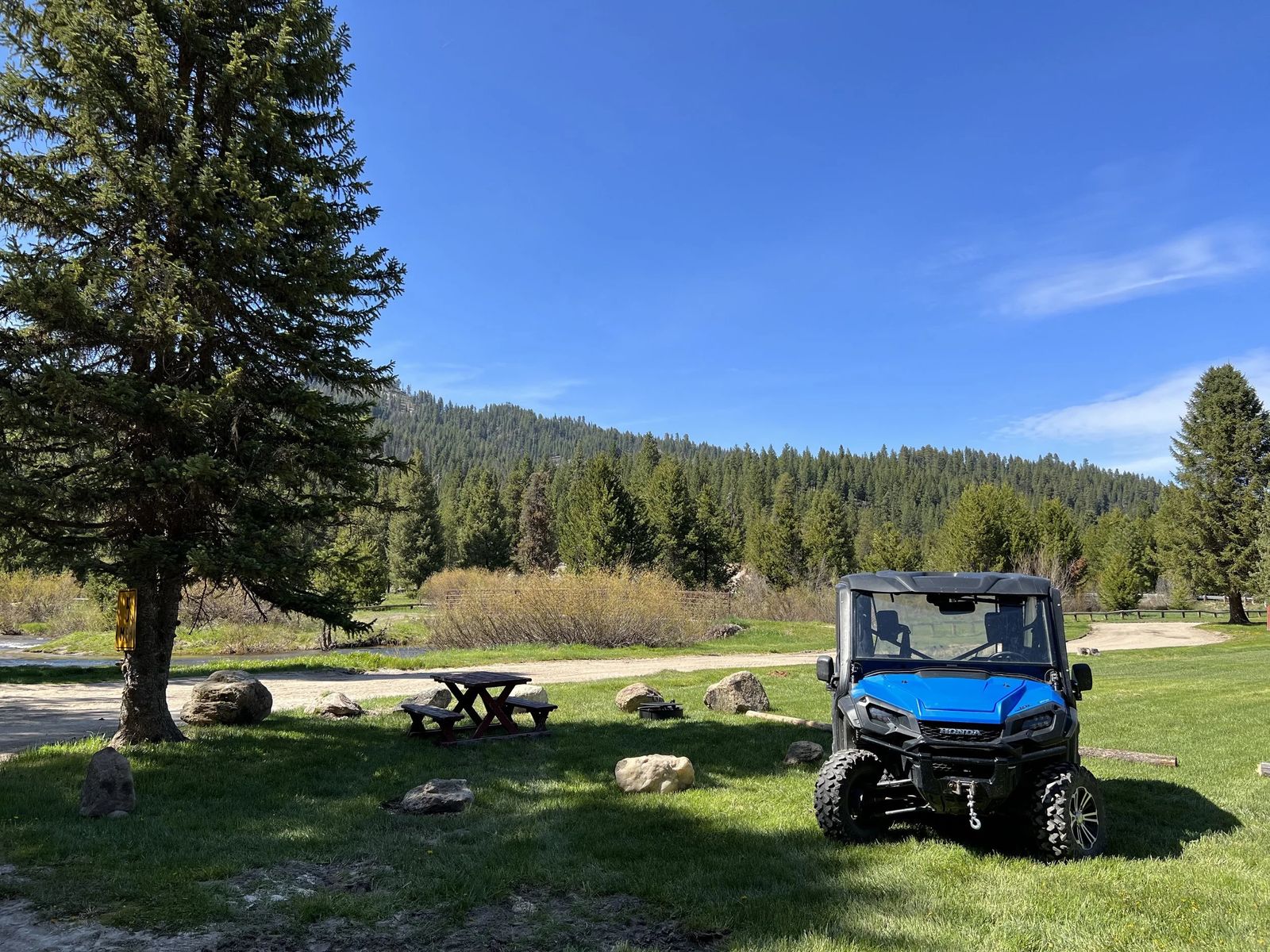 Open meadow with picnic table and Silver Creek