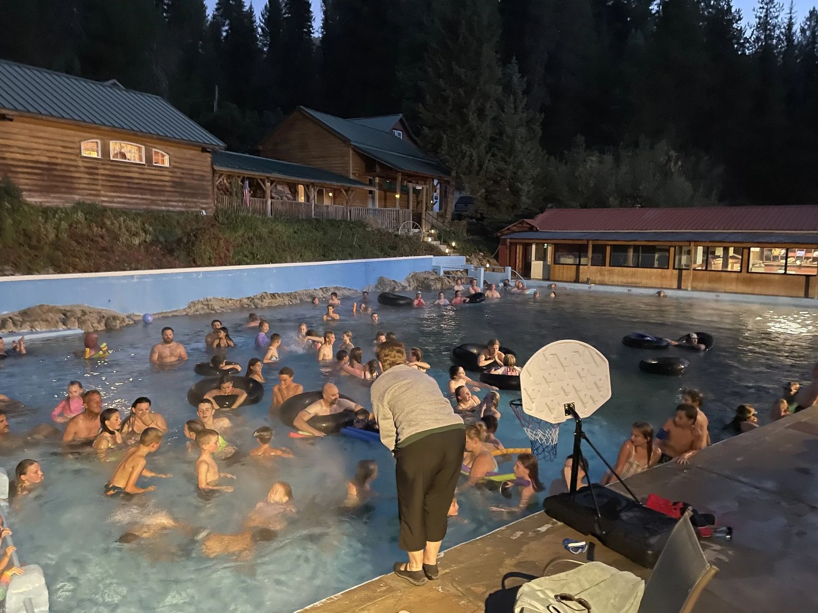 Crowd of people swimming during evening swim