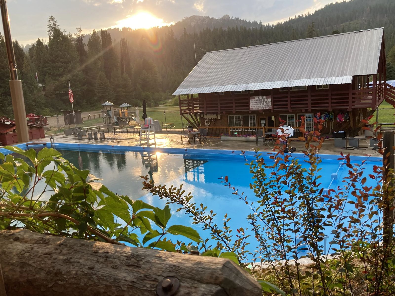 Silver Creek Plunge pool at sunset with lodge behind